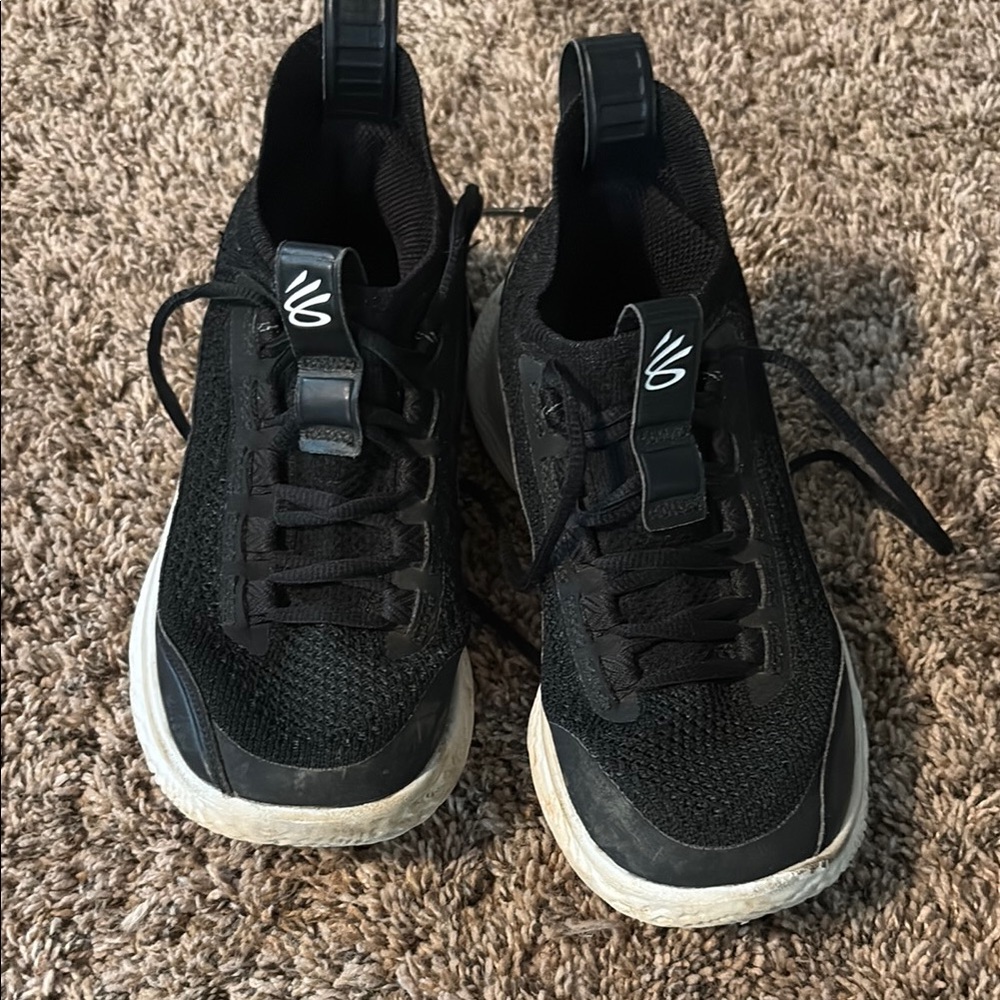 Under Armour Black and White Sneakers with Timeless Design